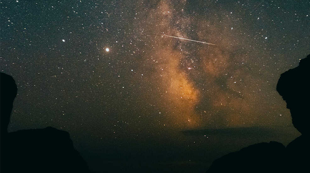 Shooting stars in a starry night sky